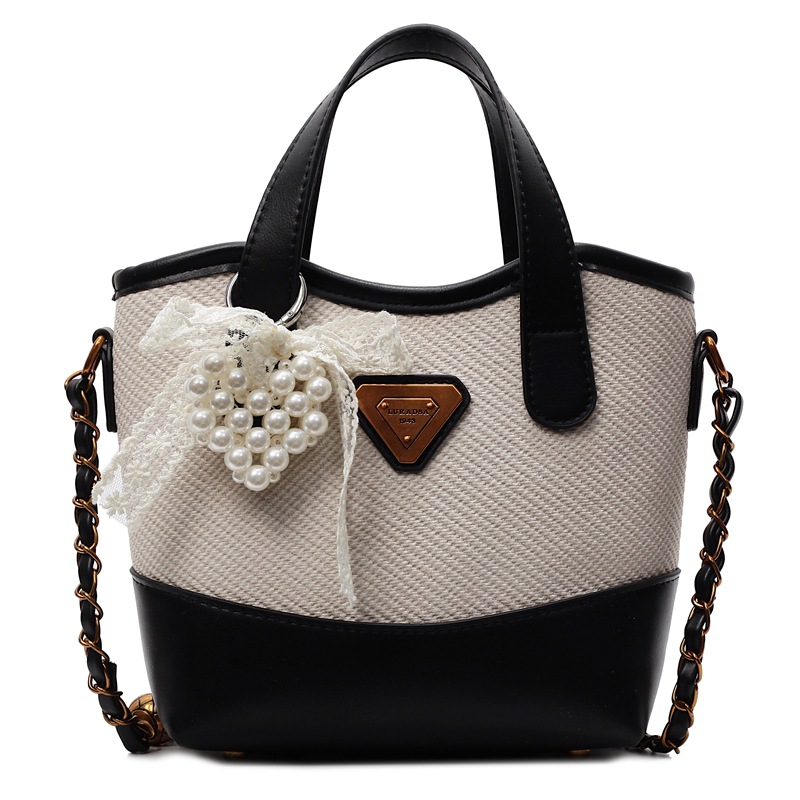 Bolso de mano de color de contraste popular de este año para mujer 2025 nuevo bolso de cubo más vendido bolso de mensajero casual de alta gama de todo fósforo