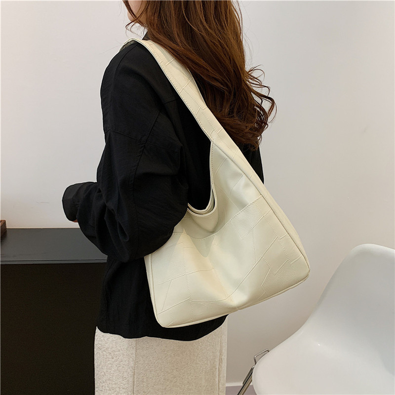 Bolso de color sólido para mujeres 2024 primavera y verano nueva bolsa de gran capacidad bolsa de moda extranjera bolsa de hombro mochila bolsa de viaje