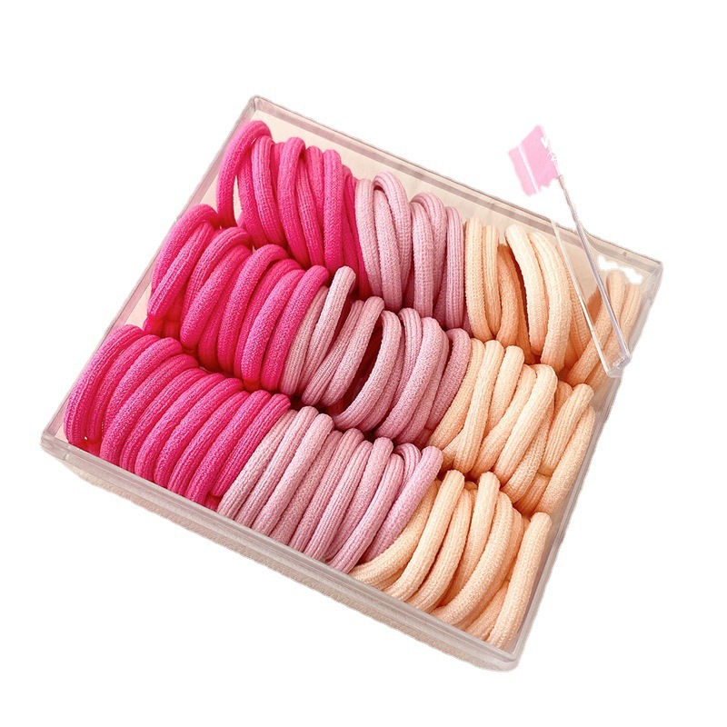 Base de banda de pelo pulgar de los niños base 90 bandas de goma cuerda de pelo para niños color caja de pelo cuerda cabeza accesorios al por mayor