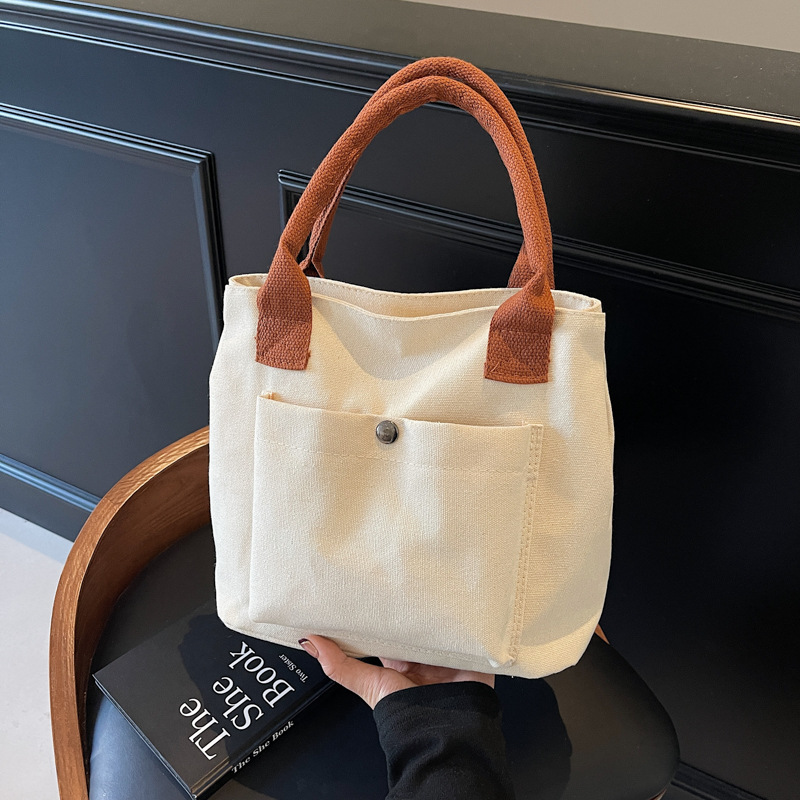 2024 nuevo bolso de lona para mujeres tela japonesa retro simple versátil Harajuku bolso de mano de color sólido casual de moda para mujeres