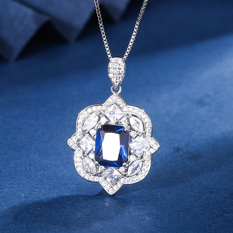 2024 nuevo estilo Zhuang Shengsheng joyería fondo de cobre chapado en oro simulación corindón rojo cristal puntiagudo azul traje retro avanzado mujer 8*10