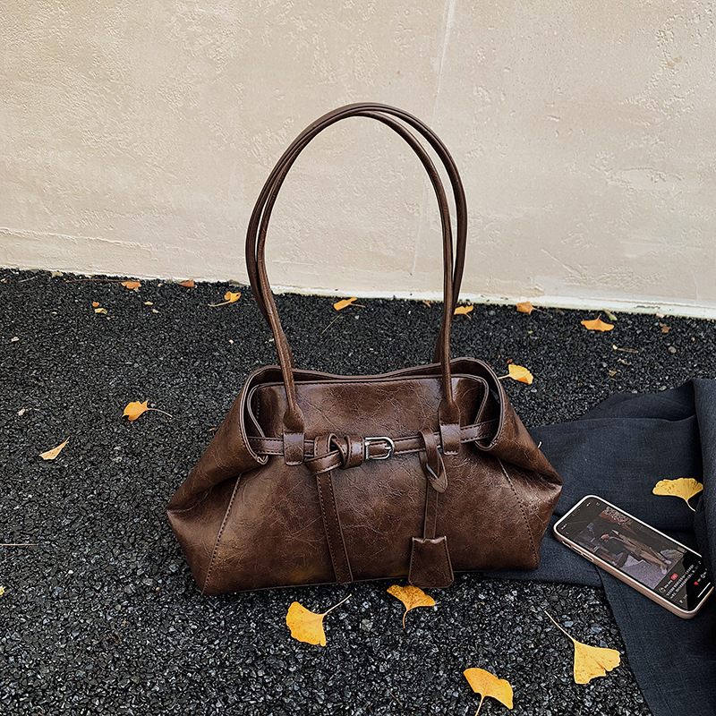 Alta textura retro gran capacidad hombro brazo bolso de mujer 2025 nuevo otoño invierno universal bolso de mano de viaje
