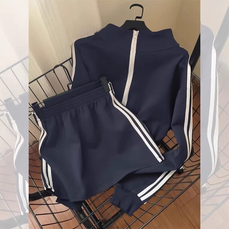 Spring and Autumn new collection: stylish blue casual sportswear set for women, featuring a stand-up collar, zip-up sweatshirt, and a youthful, short skirt – a two-piece outfit