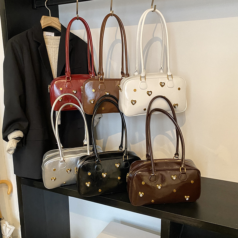 Bolsos transfronterizos de nuevo estilo para mujer Bolsos de almohada de alta gama de moda simple urbana Bolsos de hombro de todo fósforo diario para mujer