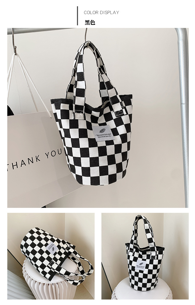 A fashionable new Japanese and Korean chic black and white checkered canvas bag, a large-capacity single-shoulder bag for women, and a simple student handbag undefined