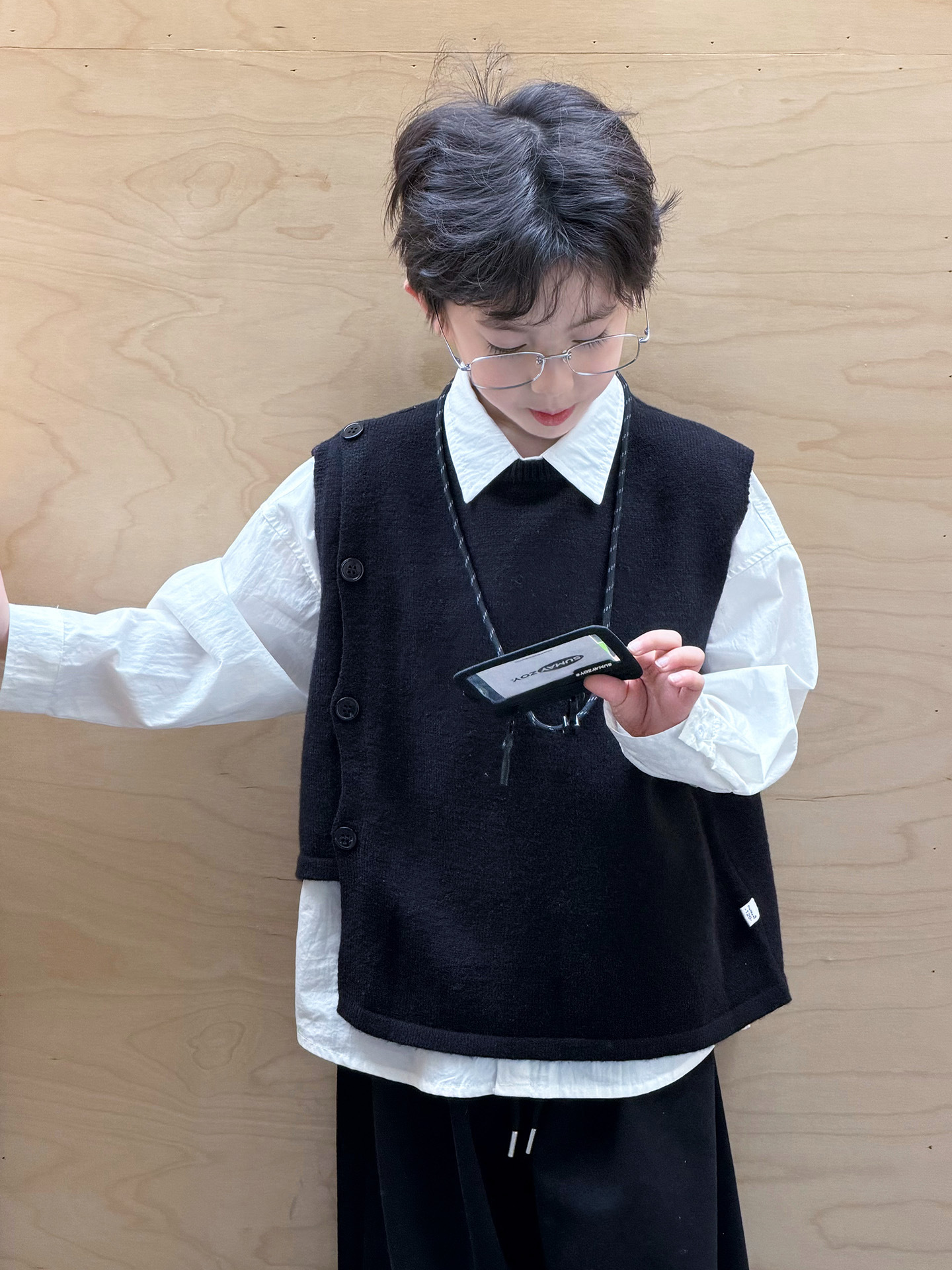 Suéter infantil camiseta de punto chaleco de punto para niños primavera y otoño 2026 ropa de niños de edad media chaleco de estilo universitario