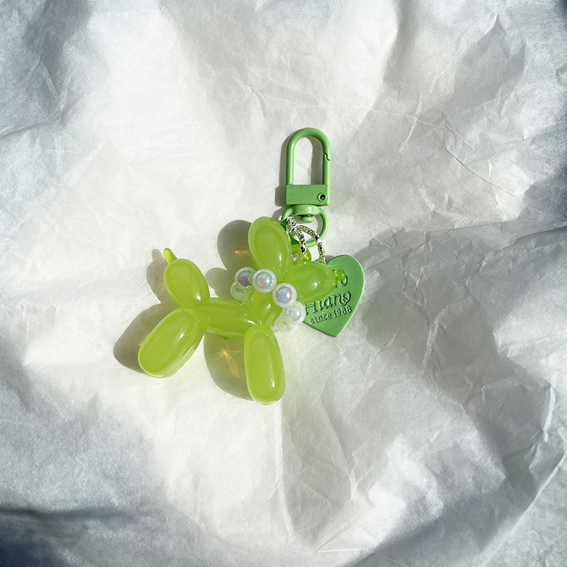 Pequeño Libro Rojo mismo lindo jalea globo láser perro llavero colgante colorido cachorro de dibujos animados teléfono llavero