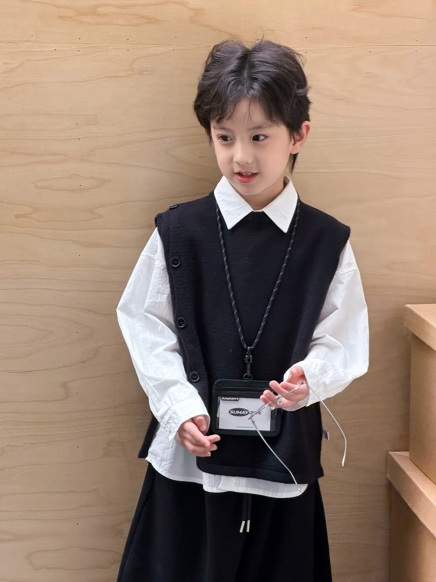 Suéter infantil camiseta de punto chaleco de punto para niños primavera y otoño 2026 ropa de niños de edad media chaleco de estilo universitario