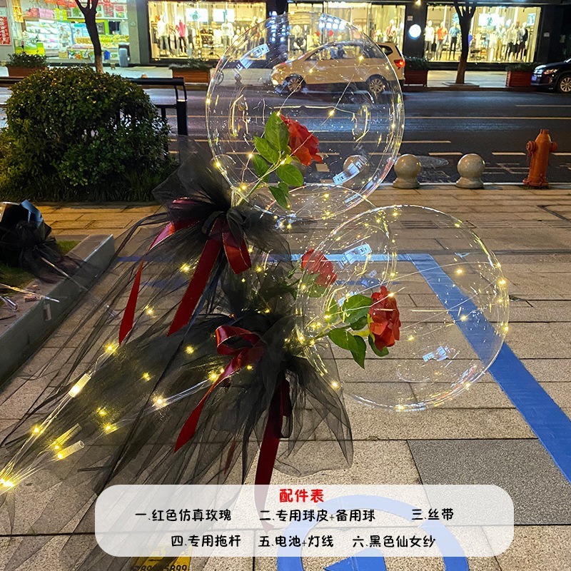 光る夜市の円形の赤い屋台のネットを並べてボールを押して会の風船のイルミネーションの明かりの告白のロマンチックな波の地帯のスーツを押します。|undefined