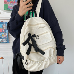 清新甜美学院风书包女初中生韩版洋气蝴蝶结双肩包纯色高中生背包