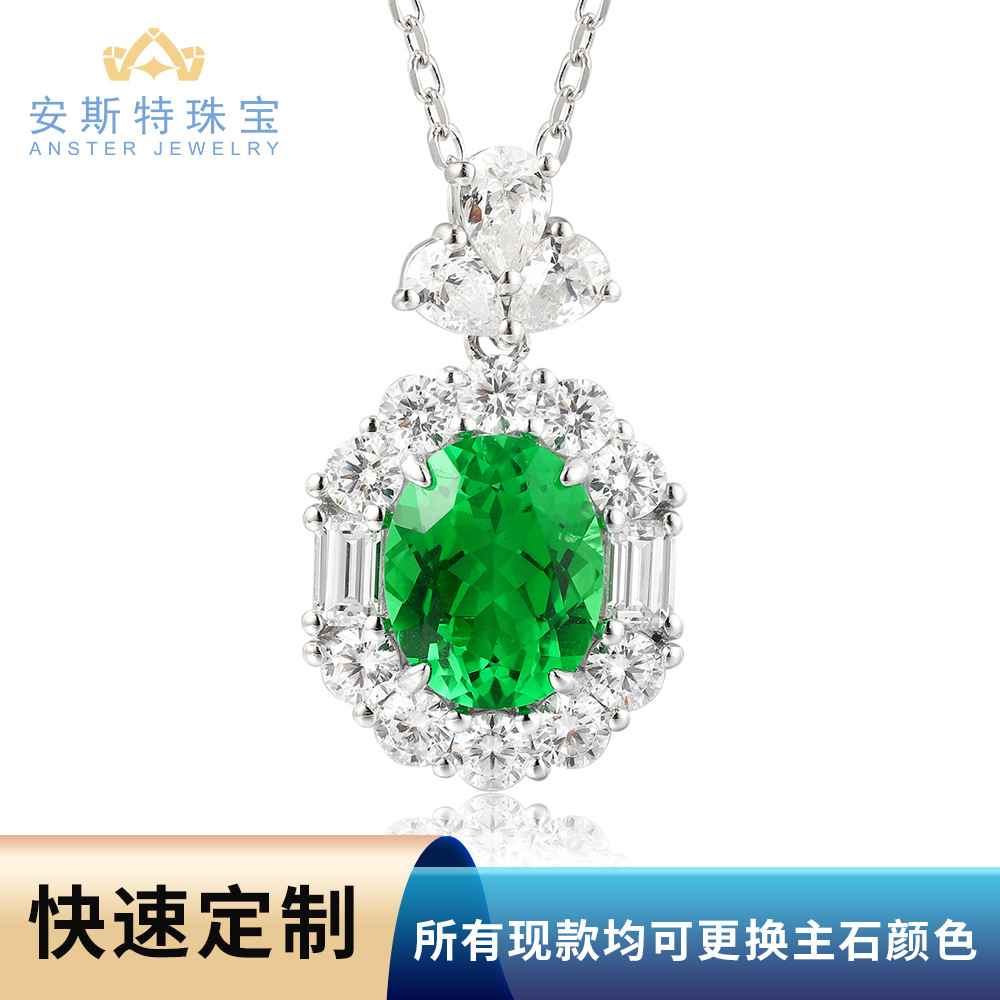 18K gold pendant necklace featuring lab-grown emeralds, Paraiba red, blue, and pink gemstones