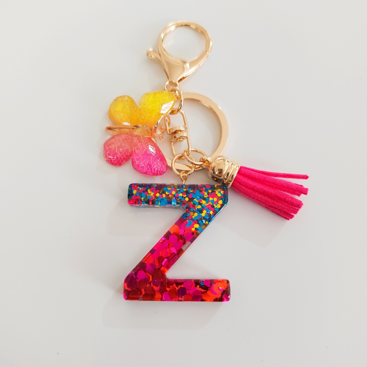 Ventas transfronterizas calientes de letras inglesas de color mixto colgante de llavero colgante de mariposa fringe de resina de llavero colgante de joyería