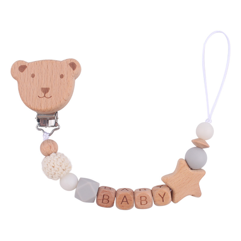 Nuevo bebé suministros de dibujos animados oso cabeza chupete clip calmante bebé nombre de madera mordedura chupete cadena anti-gota cadena