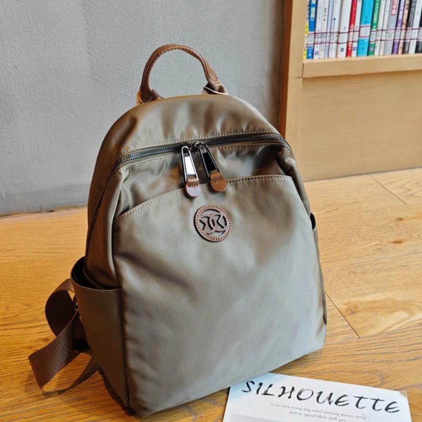 Mochila turística mujer 2024 nueva moda nicho de alta gama ligera bolsa de cercanías mochila de viaje bolsa de mamá