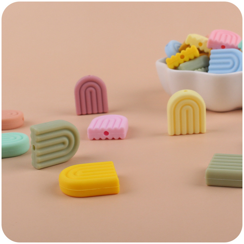 Creativo DIY bebé suministros dibujos animados silicona color sólido Arco Iris mordedor bebé molar pezón anti-gota cadena Accesorios