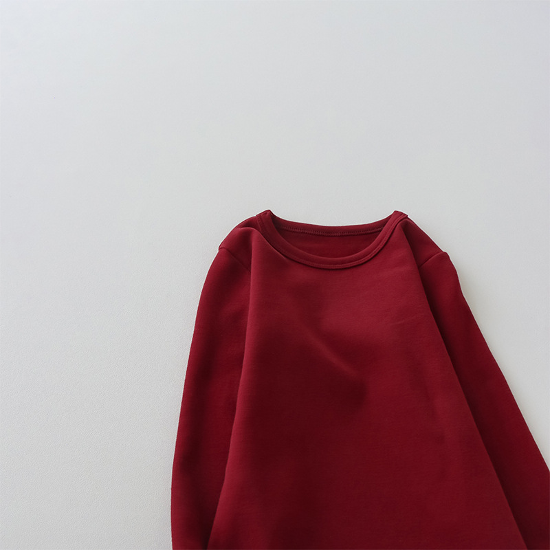 Camiseta de manga larga de algodón puro para niños 2026, camiseta básica para primavera y otoño, top cepillado de cuello redondo de color liso y corte holgado para niños y niñas.