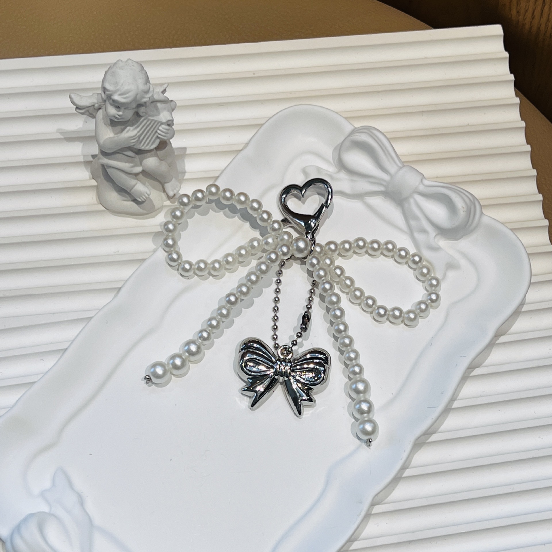 Amor botón arco perla colgar arco