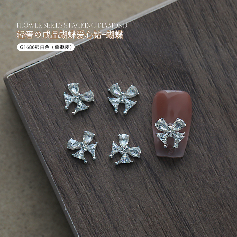 Love bowknot aleación manicura pila de diamantes productos terminados celebridades de Internet nuevas decoraciones de uñas de diamantes de pila súper flash al por mayor