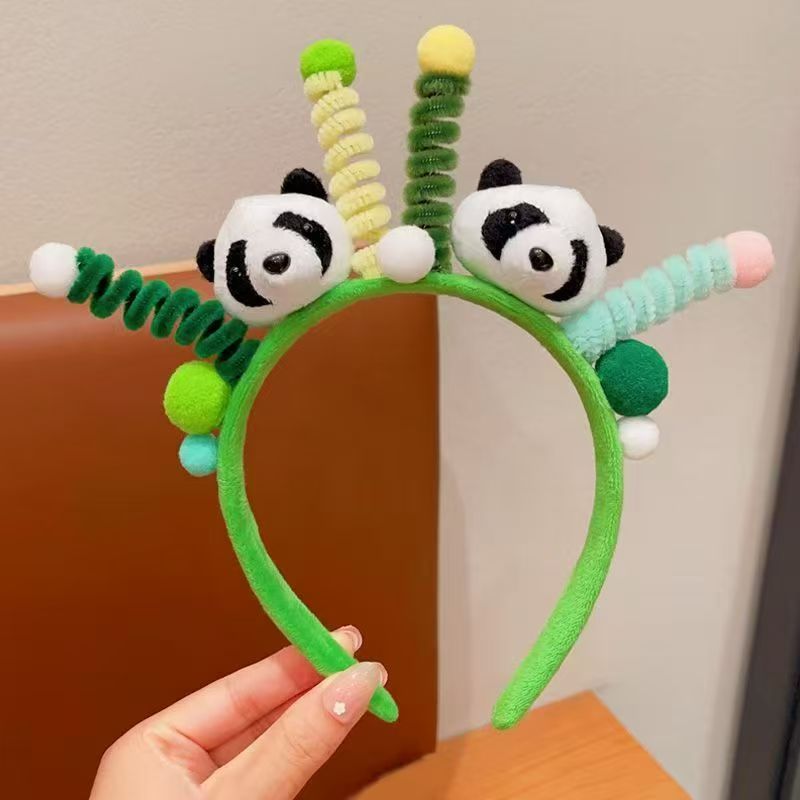 男女通用の大きいパンダのカチューシャは卸売りします。