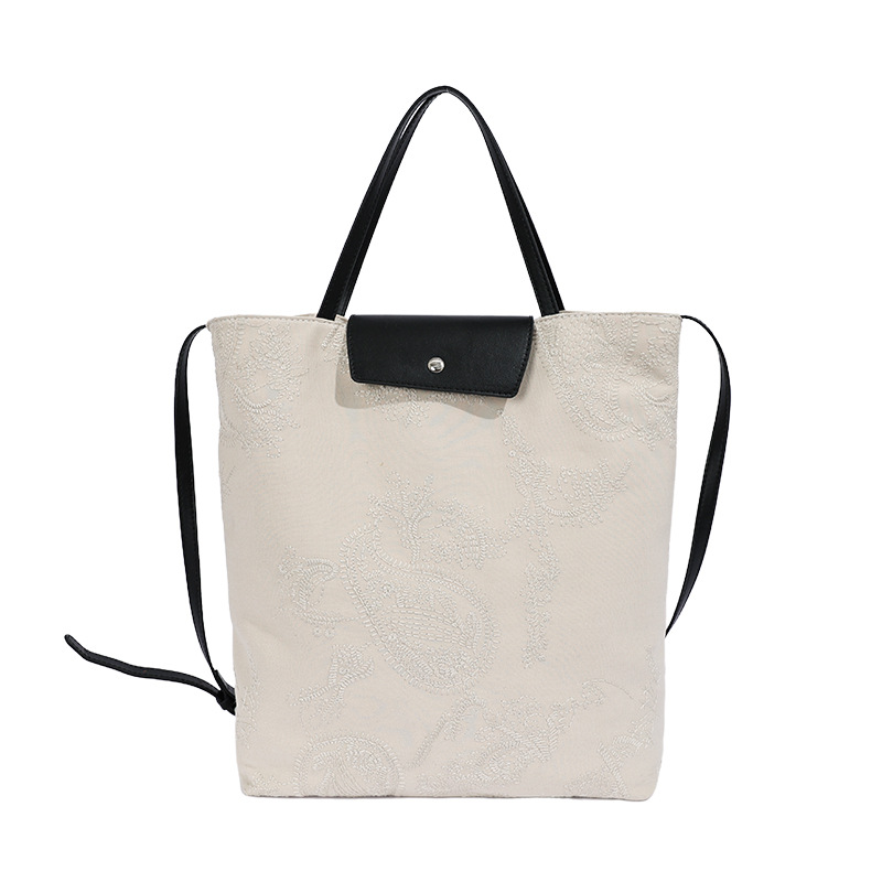 Bolso de mujer 2026 nuevo estilo coreano tela de gran capacidad bolso de mano de viaje simple diario mochila de hombro