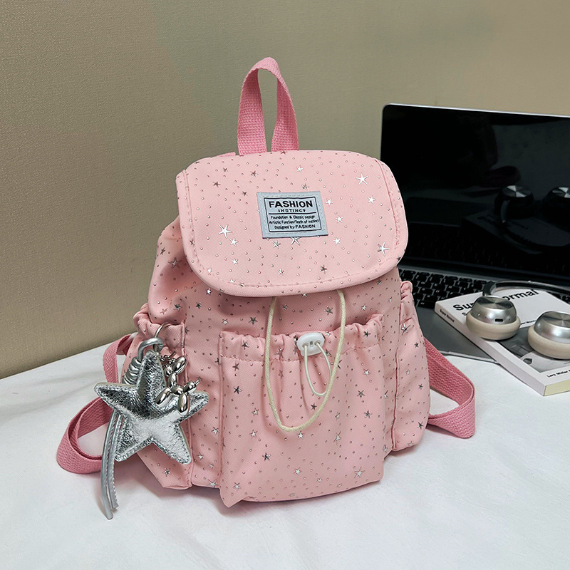 Primavera nuevo estilo ins leche de viento bonito joven estrella impresa mochila de hombro para mujeres de alto valor dulce mochila pequeña