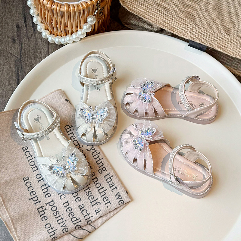 Sandálias de niñas de verano 2025, nuevos zapatos de playa para niños con suela suave, zapatos de princesa de arco