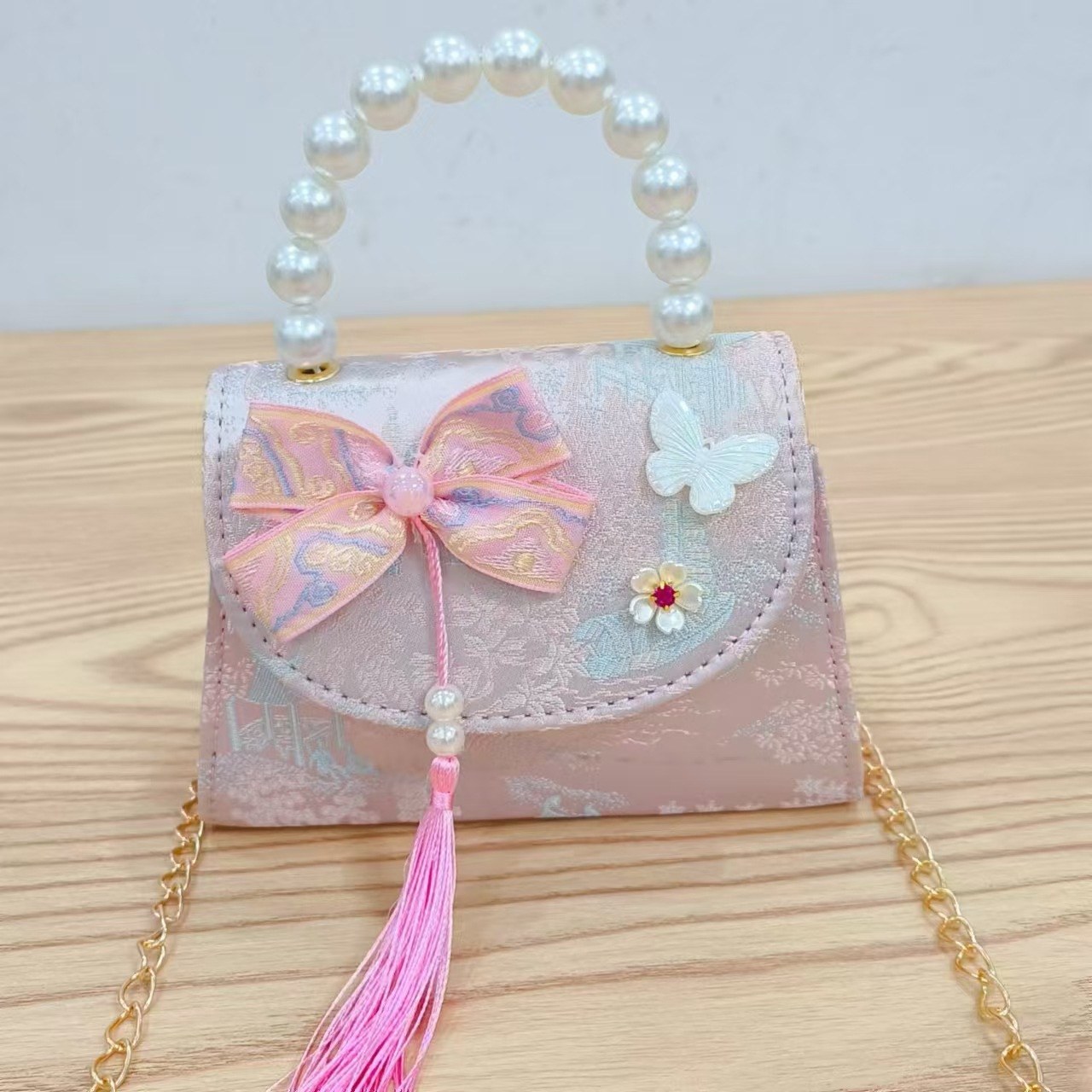 202 nuevo arco de estilo nacional bolsos para niños pequeños bolsos de moda de perlas de moda princesa bolsos de mano inclinados