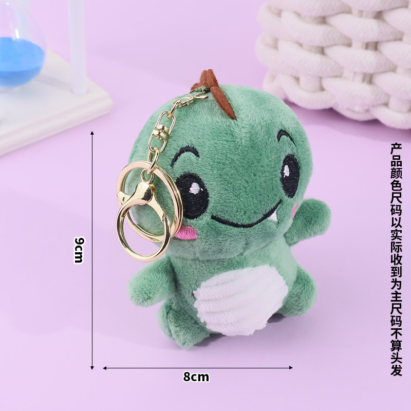 Lindo rubor pequeño sentado dinosaurio llavero de felpa bolso escolar colgante colgante máquina de garras muñeca muñeca regalo