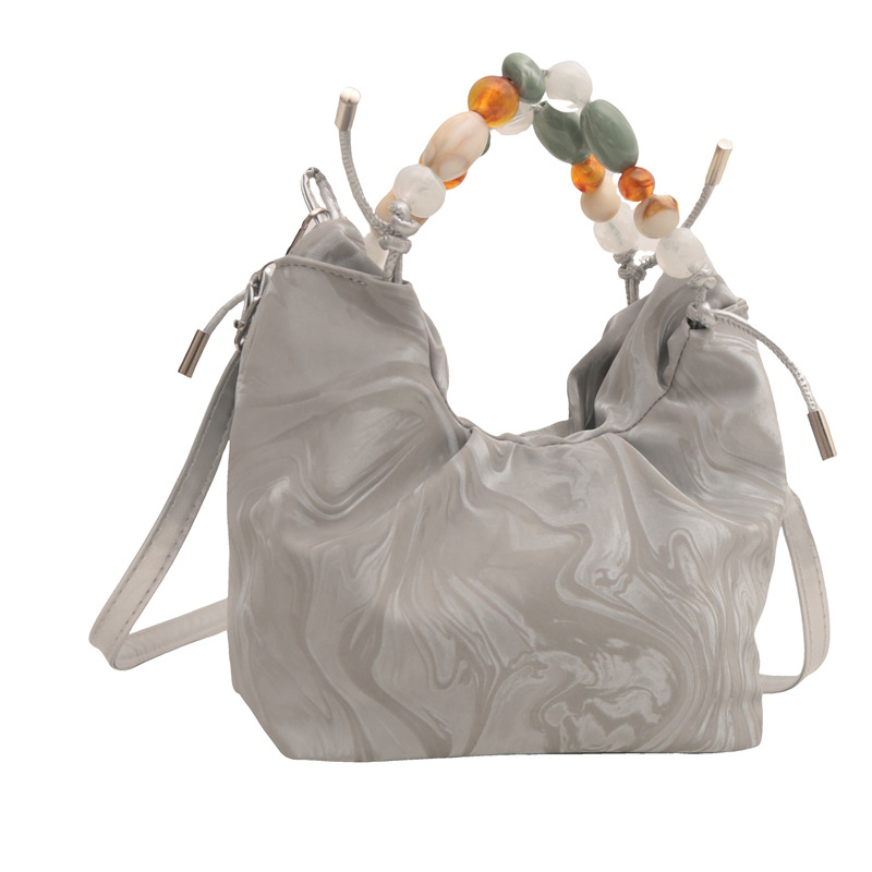 Nueva bolsa de estilo chino para mujeres 2024, nuevo verano, bolso de mochila de estilo exterior, bolso de cubo portátil super caliente.