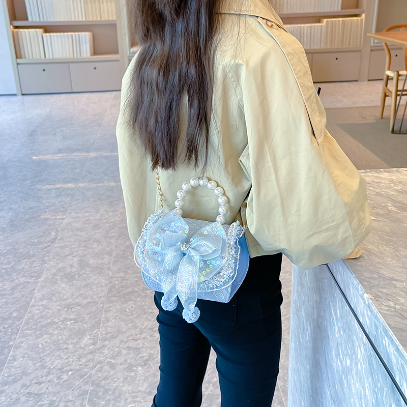 Bolso infantil de perlas 2024 nueva chica arco de moda, bolsa de tramo inclinada, princesa de moda, accesorios de algodón y lino, bolso
