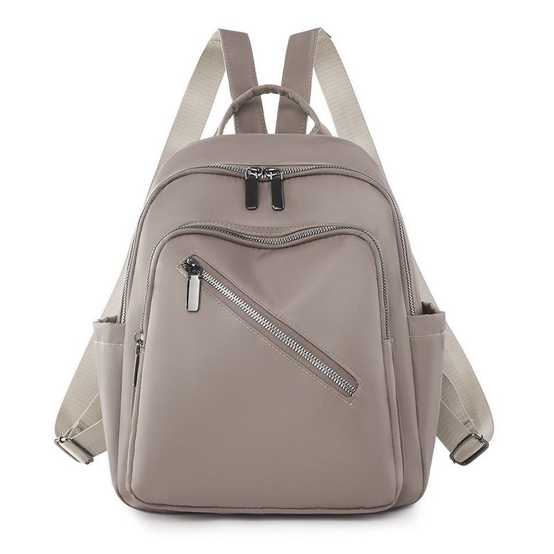 Comercio exterior al por mayor 2023 nueva mochila de nailon casual para mujer, mochila de viaje al aire libre literaria simple, mochila escolar