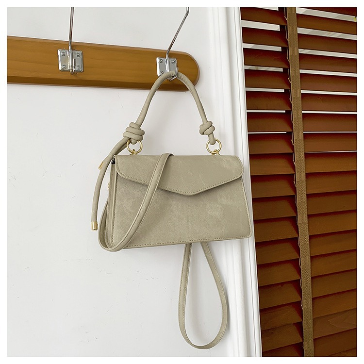 Neto rojo Joker tendencia de color sólido bolso simple bolso de las mujeres 2024 Invierno nuevo bolso cuadrado pequeño oblicuo Cruz Portátil Bolsa de costura del coche