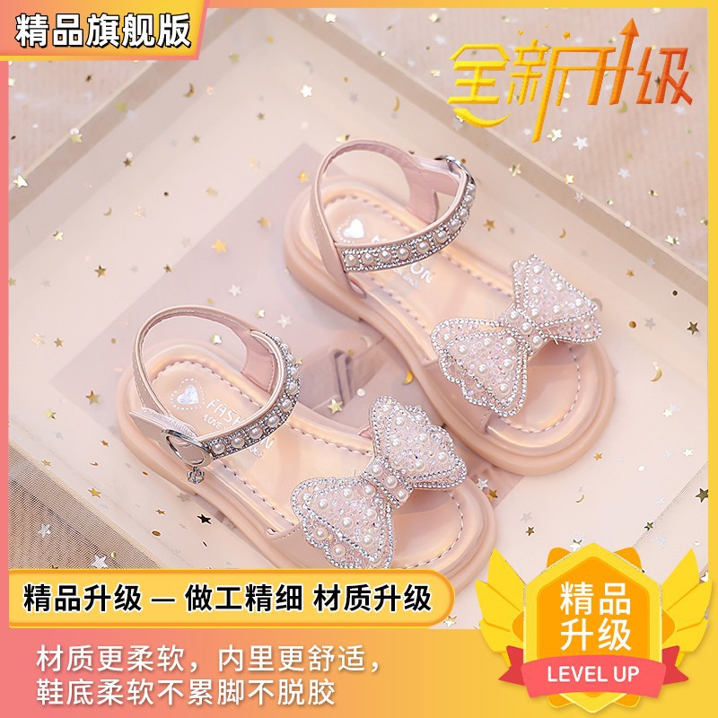 Niños verano 2026 nuevas sandalias de niñas arco brillante con base suave princesa sandalias de viento para niñas sandalias