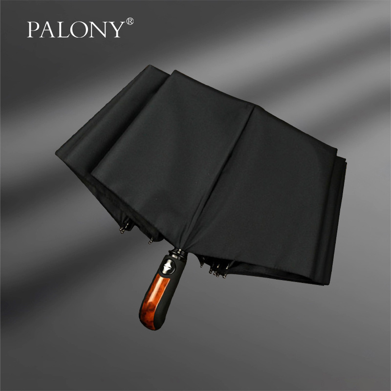 Paraguas de elefante automático triple de cuero de imitación mango de madera de diez huesos extra grandes hombres de negocios paraguas de tres pliegues automático negro puro