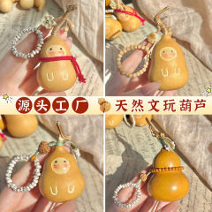 かわいい赤ちゃんの文はヒョウタンの植物の手を遊んで手を捻ってペンダントの皿を遊んでヒョウタンの置物の民間の芸術品の卸売りをします。