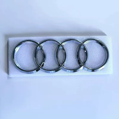 Audi TT car emblem modification: Car logo - standard-front-center-grille-four-ring-logo-bright-silver-remarks-model-year