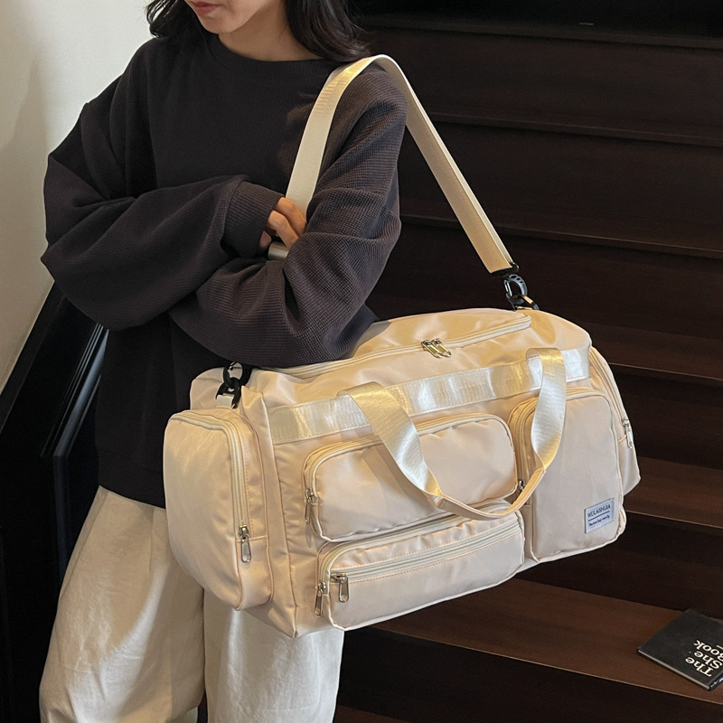 2025 nueva moda bolsa deportiva de fitness seca y húmeda separación bolsa de natación para hombres bolsa de viaje de hombro portátil de tela Oxford para mujeres