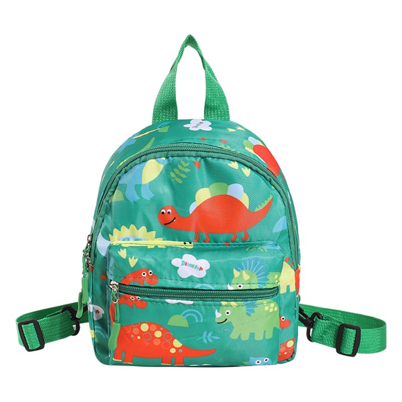 Mochila nueva al por mayor 2025, mochila de tela Oxford con diseño de dinosaurio de dibujos animados, mochila pequeña de gran capacidad para actividades al aire libre y ocio.