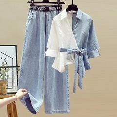2024欧米の大きいサイズの婦人服の春のスーツの女性は偽の2つのシャツをつなぎ合わせてやせているジーパンの2つのセットを現します。