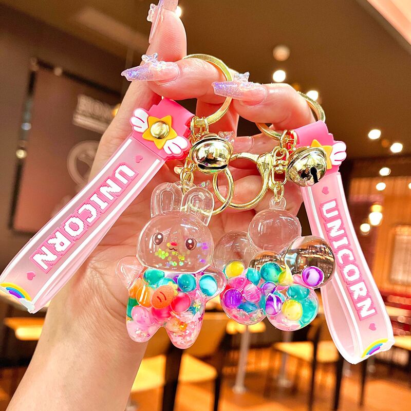 Creative cartoon luminous oil bottle rainbow jelly beans quicksand bottle keychain car key chain bag pendant 