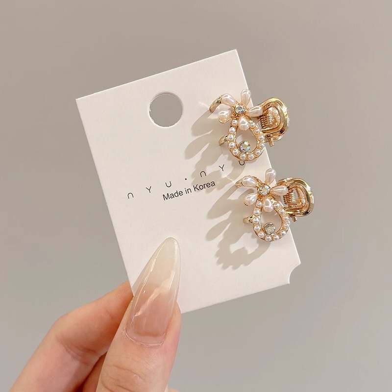 甘いクールな蝶結びの金属の小さいサイズのヘアピンの女性のサイドクリップの額の無痕の前髪の砕毛クリップの髪飾り|undefined