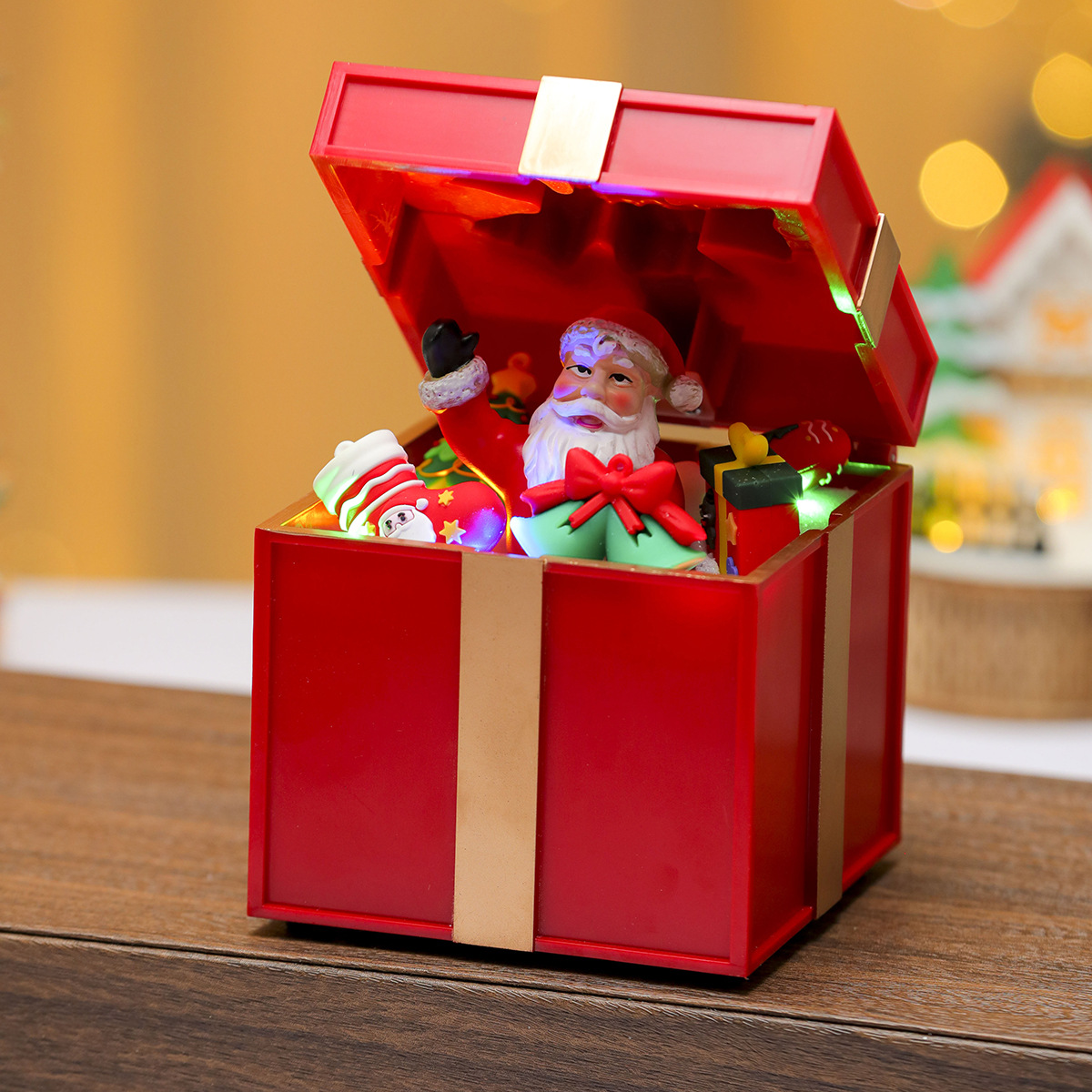 Una variedad de adornos de caja de música luminosa de resina giratoria de Navidad, adornos de tren giratorio, regalos de Navidad