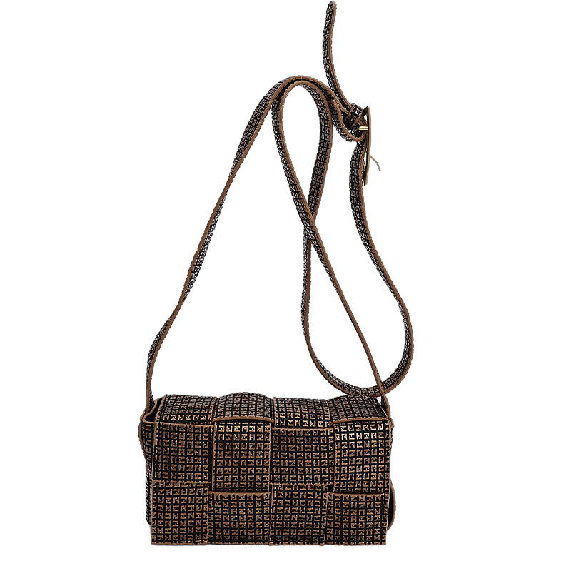 2025 nuevo otoño trenzado empalme de color sólido personalidad simple temperamento fresco estilo de hombro bolso de viaje