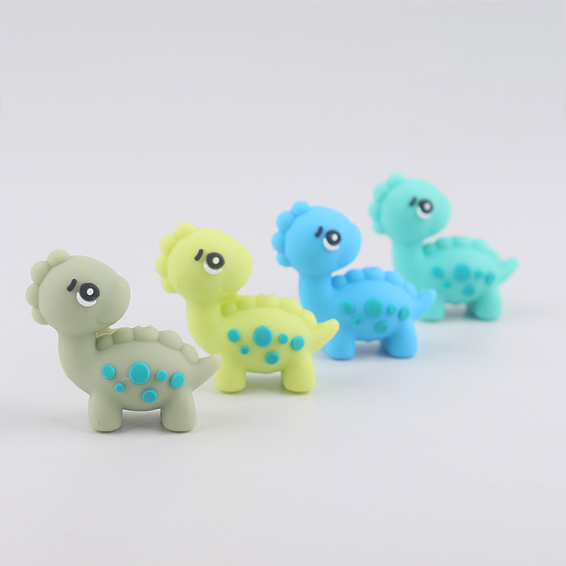 Dibujos animados Dinosaur Dental Topeador Cuentas de goteo Bolígrafo de cuentas de bricolaje Pezones para bebés Cadena anti-caída Amazon