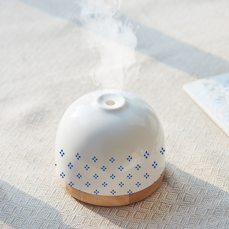Fabricante al por mayor Guochao Wenchuang regalo creativo 300ML máquina de fragancia de madera sólida cerámica auto-expandir aceite esencial humidificar