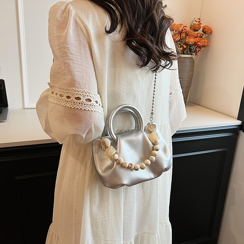 High end handbag for women in 2024, new niche design, summer handheld pleated chain strap, crossbody cloud bag_voghion.com