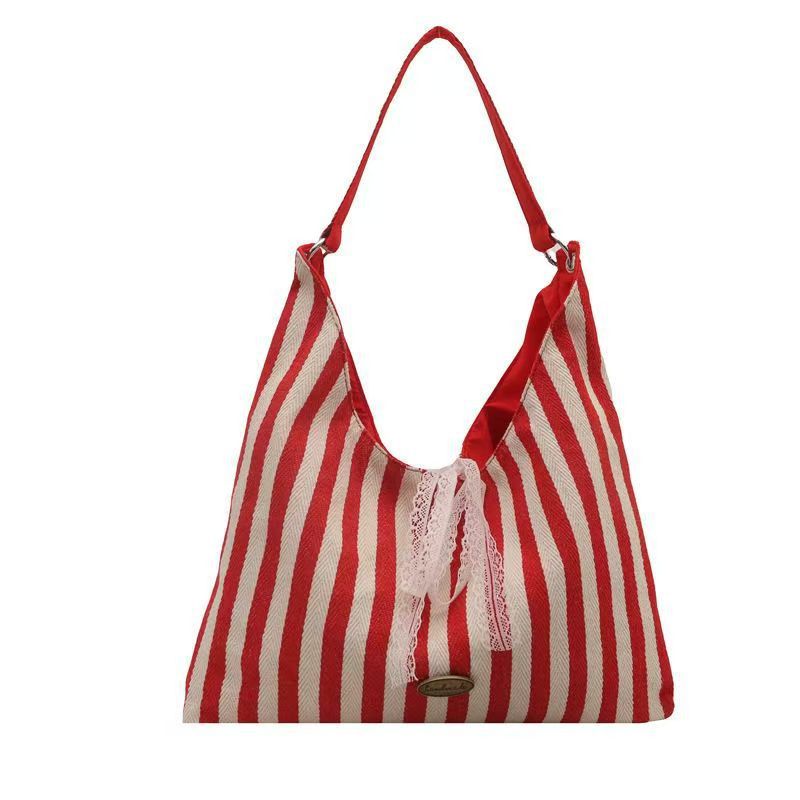 Nieuwe, ruime, gestreepte schoudertas voor dames, een eenvoudige en casual tas voor woon-werkverkeer, veelzijdig en dubbelzijdig te gebruiken._voghion.com