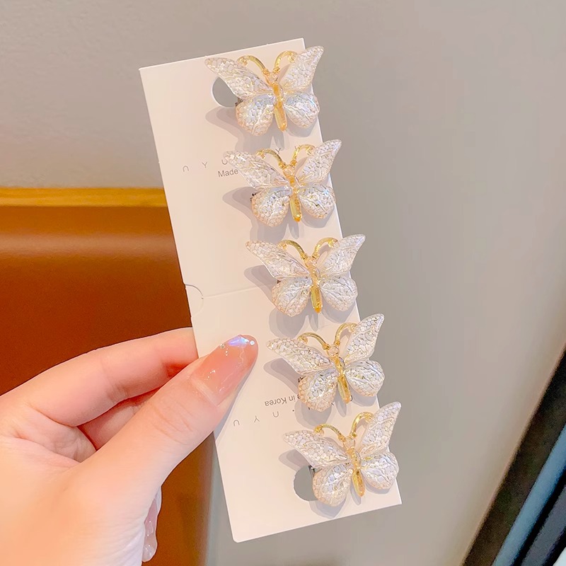 Estilo explosivo Super Fairy Symphony Horquilla de mariposa tridimensional Clip de pelo roto femenino Tocado Clip de pico de pato Horquilla para niños con sentido avanzado