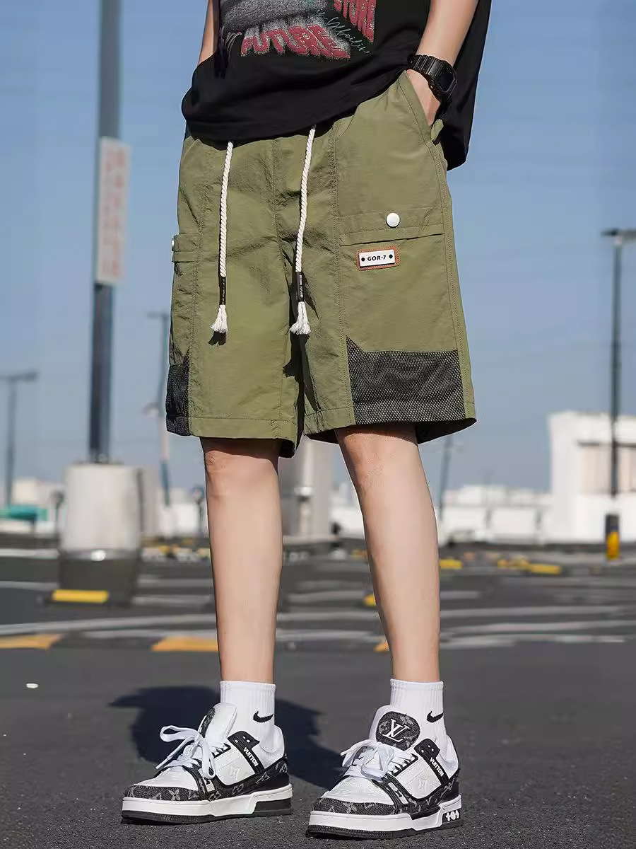 Pantalones cortos de seda de hielo de moda de verano para hombres. Pantalones de aire secos. Pantalones de cinco puntos. Pantalones de hombre grandes.