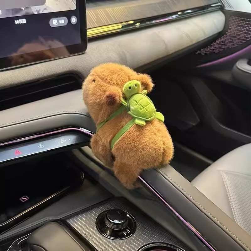 Capibara automóviles decoración interior de automóviles accesorios de brazo muñecas de peluche Dolphin carro de muñecas de consola central